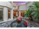 Inviting courtyard with a central water feature and plants at 8437 N 84Th Pl, Scottsdale, AZ 85258