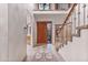 Two-story entry with a grand staircase and tile flooring at 8437 N 84Th Pl, Scottsdale, AZ 85258
