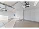 Finished garage with epoxy flooring and storage cabinets at 8437 N 84Th Pl, Scottsdale, AZ 85258