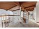Upper hallway with chandelier, wood beams, and carpeted flooring at 8437 N 84Th Pl, Scottsdale, AZ 85258