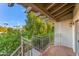 Private patio with wrought iron railing and citrus trees at 8437 N 84Th Pl, Scottsdale, AZ 85258