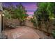 Private patio with spiral staircase, tile flooring, and lush landscaping at 8437 N 84Th Pl, Scottsdale, AZ 85258