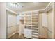 Large walk-in closet with ample shelving and hanging space at 8437 N 84Th Pl, Scottsdale, AZ 85258