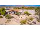 Aerial view of house with landscaped yard and mountain views at 9446 E Romping Rd, Carefree, AZ 85377