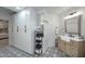 Bathroom with light wood vanity, patterned floor, and ample storage at 9446 E Romping Rd, Carefree, AZ 85377