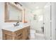 Clean bathroom with a walk-in shower, toilet and modern vanity at 9446 E Romping Rd, Carefree, AZ 85377