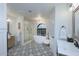 Spa-like bathroom with soaking tub, walk-in shower, and patterned tile floor at 9446 E Romping Rd, Carefree, AZ 85377