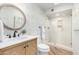 Updated bathroom with a walk-in shower, stylish vanity, and patterned tile at 9446 E Romping Rd, Carefree, AZ 85377