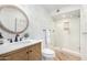 Updated bathroom with a walk-in shower, stylish vanity, and patterned tile at 9446 E Romping Rd, Carefree, AZ 85377