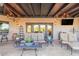 Relaxing covered patio features comfortable seating and a beautiful view at 9446 E Romping Rd, Carefree, AZ 85377