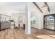 Bright dining area with large windows, chandelier, and a rustic wooden table at 9446 E Romping Rd, Carefree, AZ 85377