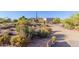 Long driveway leading to a desert home entrance at 9446 E Romping Rd, Carefree, AZ 85377