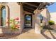 Inviting entryway with a stylish front door and landscaping at 9446 E Romping Rd, Carefree, AZ 85377