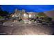 Stunning desert home with a brick driveway and beautifully landscaped front yard at 9446 E Romping Rd, Carefree, AZ 85377