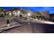 Night view of a beautiful desert home with a large front yard and brick driveway at 9446 E Romping Rd, Carefree, AZ 85377