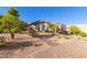 Landscaped front yard with desert plants and brick driveway at 9446 E Romping Rd, Carefree, AZ 85377