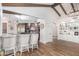 Modern kitchen with granite counters, stainless steel appliances, and wood beams at 9446 E Romping Rd, Carefree, AZ 85377