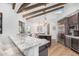 Granite countertops and stainless steel appliances in this eat-in kitchen at 9446 E Romping Rd, Carefree, AZ 85377
