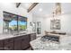 Kitchen with granite countertops, stainless steel appliances, and breakfast bar at 9446 E Romping Rd, Carefree, AZ 85377