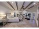 Main bedroom with wood beams, fireplace and access to backyard at 9446 E Romping Rd, Carefree, AZ 85377