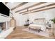 Large main bedroom with fireplace, high ceilings, and wood beams at 9446 E Romping Rd, Carefree, AZ 85377