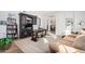 Home office with built-in shelving, large desk, and comfortable seating at 9446 E Romping Rd, Carefree, AZ 85377