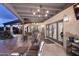 Relaxing covered patio with comfortable seating and elegant lighting at 9446 E Romping Rd, Carefree, AZ 85377