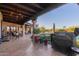 Outdoor kitchen and dining area with a covered patio at 9446 E Romping Rd, Carefree, AZ 85377