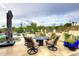 Inviting pool area with patio furniture and a fire pit table at 9446 E Romping Rd, Carefree, AZ 85377
