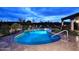 Inviting kidney-shaped pool with surrounding stone patio at 9446 E Romping Rd, Carefree, AZ 85377