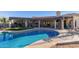 Inviting kidney-shaped pool with expansive patio area at 9446 E Romping Rd, Carefree, AZ 85377