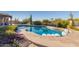 Stunning kidney-shaped pool with spacious patio and lush landscaping at 9446 E Romping Rd, Carefree, AZ 85377