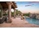 Luxury pool and spa with seating, and fountain features at 10125 E Sundance Trl, Scottsdale, AZ 85262