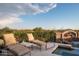 Relaxing poolside lounge chairs with scenic views at 10125 E Sundance Trl, Scottsdale, AZ 85262