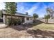 Large backyard with grassy area and mature trees at 102 W Kerry Ln, Phoenix, AZ 85027