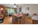 Dining area with wood floors and a table set for four at 10340 W Mountain View Rd, Sun City, AZ 85351