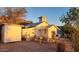 House exterior with garden and shed in the background at 110 N Pinal Ave, Superior, AZ 85173