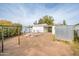 Backyard with a clothesline, washer and dryer, and a shed at 121 W Glenrosa Ave, Phoenix, AZ 85013