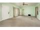 Spacious bedroom with green walls, carpeted flooring, and a ceiling fan at 121 W Glenrosa Ave, Phoenix, AZ 85013