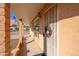 Front entrance with decorative metal security door and wreath at 12607 N Pebble Beach Dr, Sun City, AZ 85351