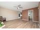 Open living room with wood-look floors and view of kitchen at 12607 N Pebble Beach Dr, Sun City, AZ 85351