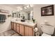 Double vanity bathroom with updated fixtures and a large mirror at 145 N 74Th St # 108, Mesa, AZ 85207