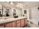 Bathroom with double sinks, tub, and shower at 145 N 74Th St # 108, Mesa, AZ 85207