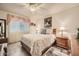 Spacious bedroom with a ceiling fan, wood nightstands, and a large bed at 145 N 74Th St # 108, Mesa, AZ 85207