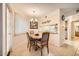 Bright dining area features a wood table and chairs, and a view into the kitchen at 145 N 74Th St # 108, Mesa, AZ 85207