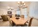 Cozy dining area with a wood table and chairs, adjacent to the living room at 145 N 74Th St # 108, Mesa, AZ 85207