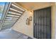 Condo entry with metal security door and stairs at 145 N 74Th St # 108, Mesa, AZ 85207