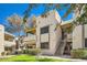 Attractive tan condo building with well-maintained lawn at 145 N 74Th St # 108, Mesa, AZ 85207