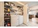 Laundry room with washer, dryer, and ample storage shelves at 145 N 74Th St # 108, Mesa, AZ 85207