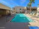 Inviting community pool with lounge chairs and patio tables at 145 N 74Th St # 108, Mesa, AZ 85207
